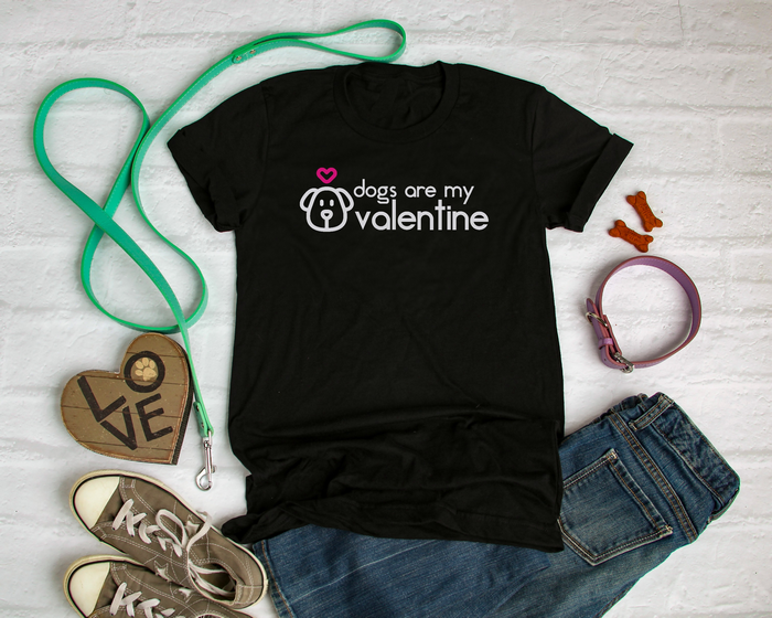 black t-shirt with SVG design that reads Dogs Are My Valentine in vinyl, next to dog leash and collar