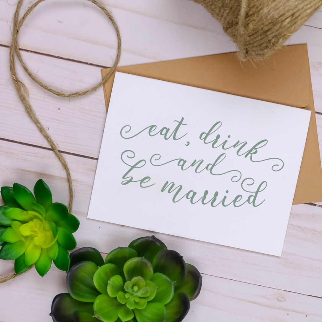 farmhouse style Eat, Drink and Be Married notecard next to twine and succulents