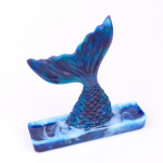 diving resin mermaid figurine on a white background
