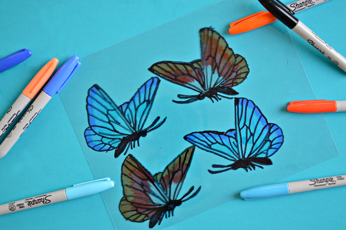 blue and orange sharpies and shrink plastic