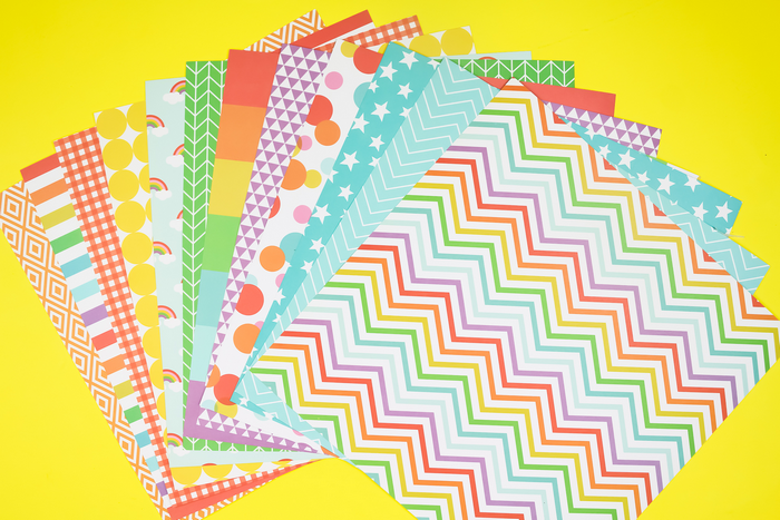 colorful scrapbook paper on a yellow background