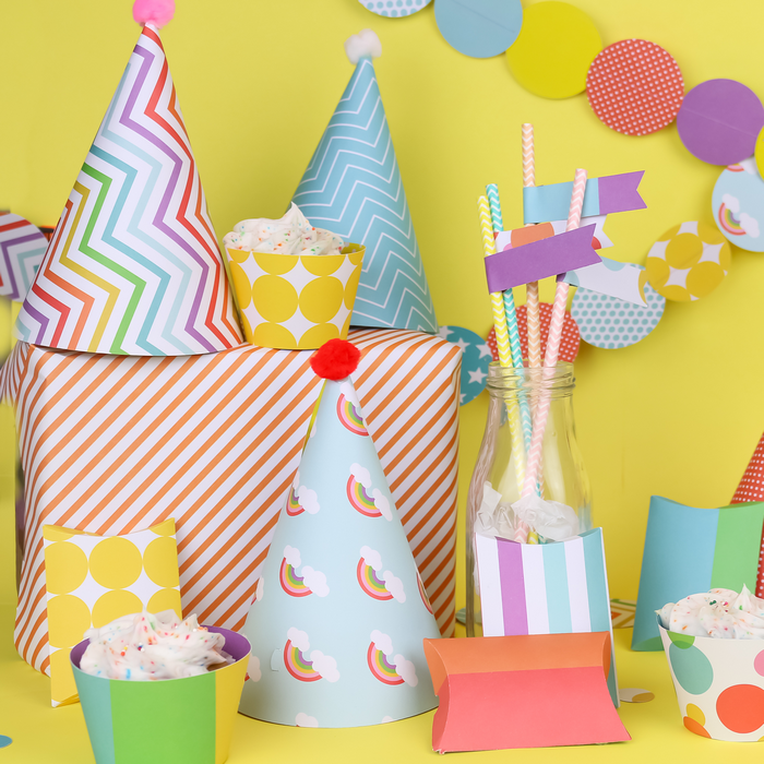 Colorful paper party supplies made with a Cricut machine