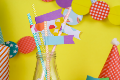 colorful DIY paper straw flags in a bottle