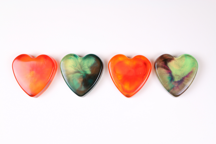 4 colorful resin heart paperweights