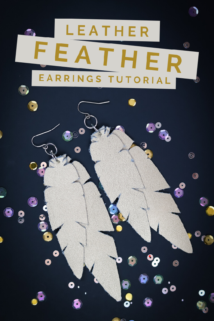 Cricut Leather feather earrings on a black background with sequins