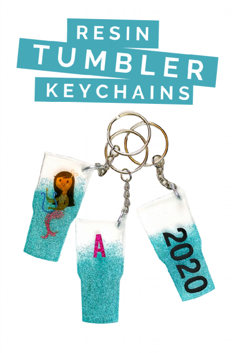 3 diy resin tumbler shaped key chains on a white background