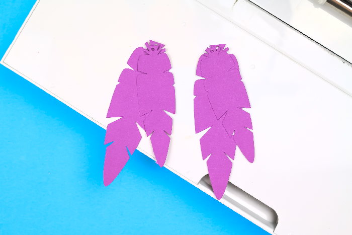 purple paper feather earrings on a Cricut Maker