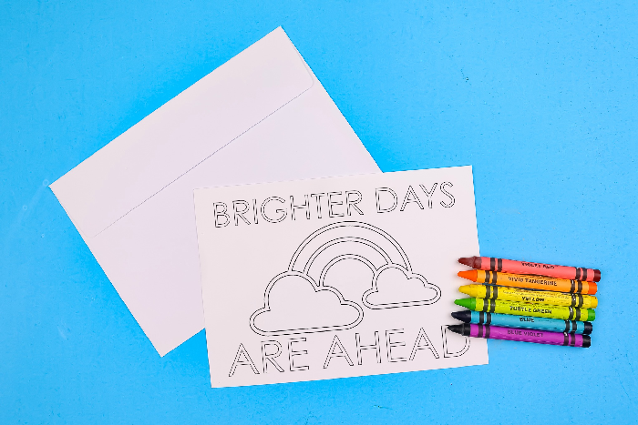 coloring page greeting cards and crayons on a blue background