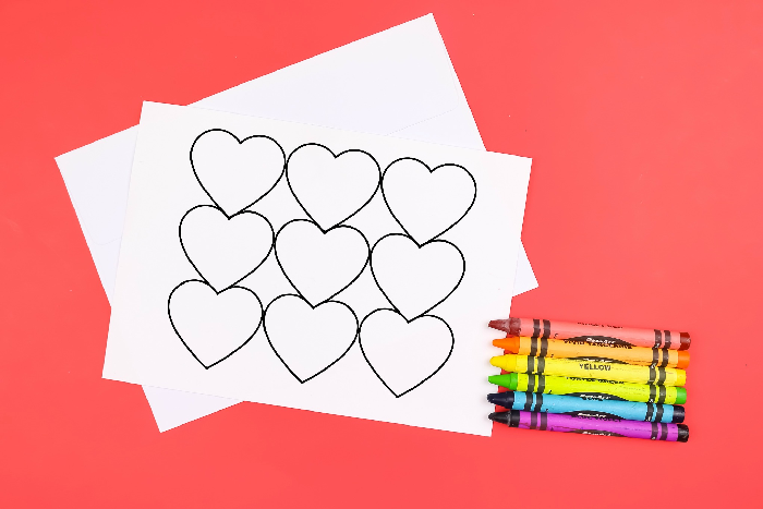 coloring page greeting cards and crayons on a red background
