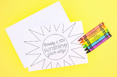 coloring page greeting cards and crayons on a yellow background