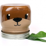 otter painted mason jar on a white background