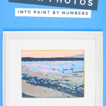 paint by number painting in a white frame on a blue background
