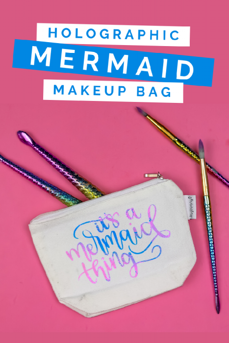 zipper pouch with a vinyl design that says it's a mermaid thing on a pink background with makeup brushes