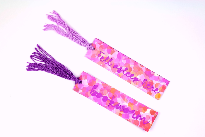 Closeup of paper bookmarks with a tassel