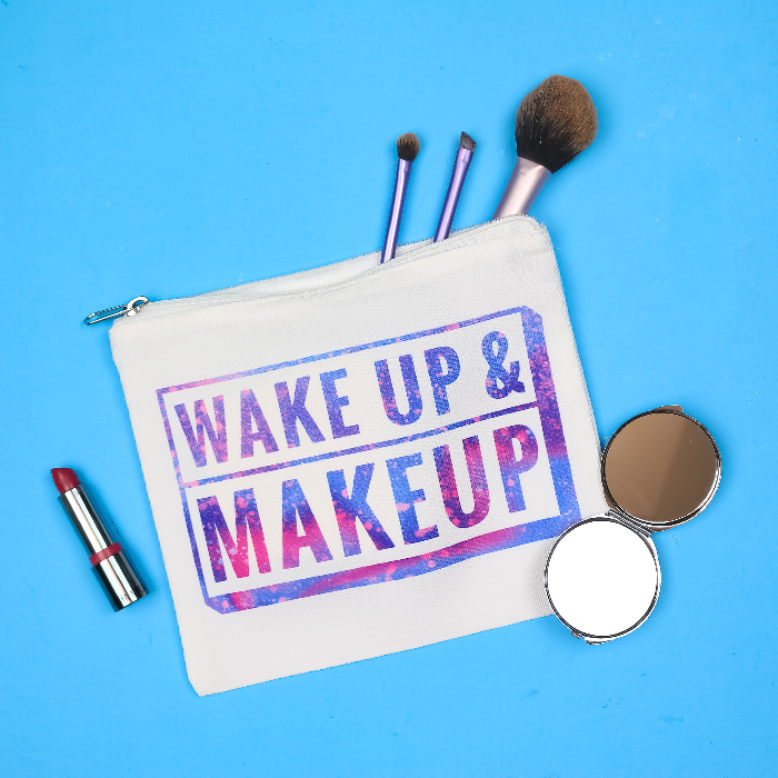 Wake up and Makeup Infusible Ink bag with makeup on a blue background