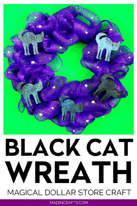 purple mesh wreath with black cat shapes and rhinestones on a green background