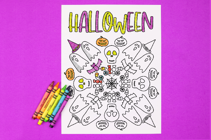 Halloween coloring page with crayons on a purple background