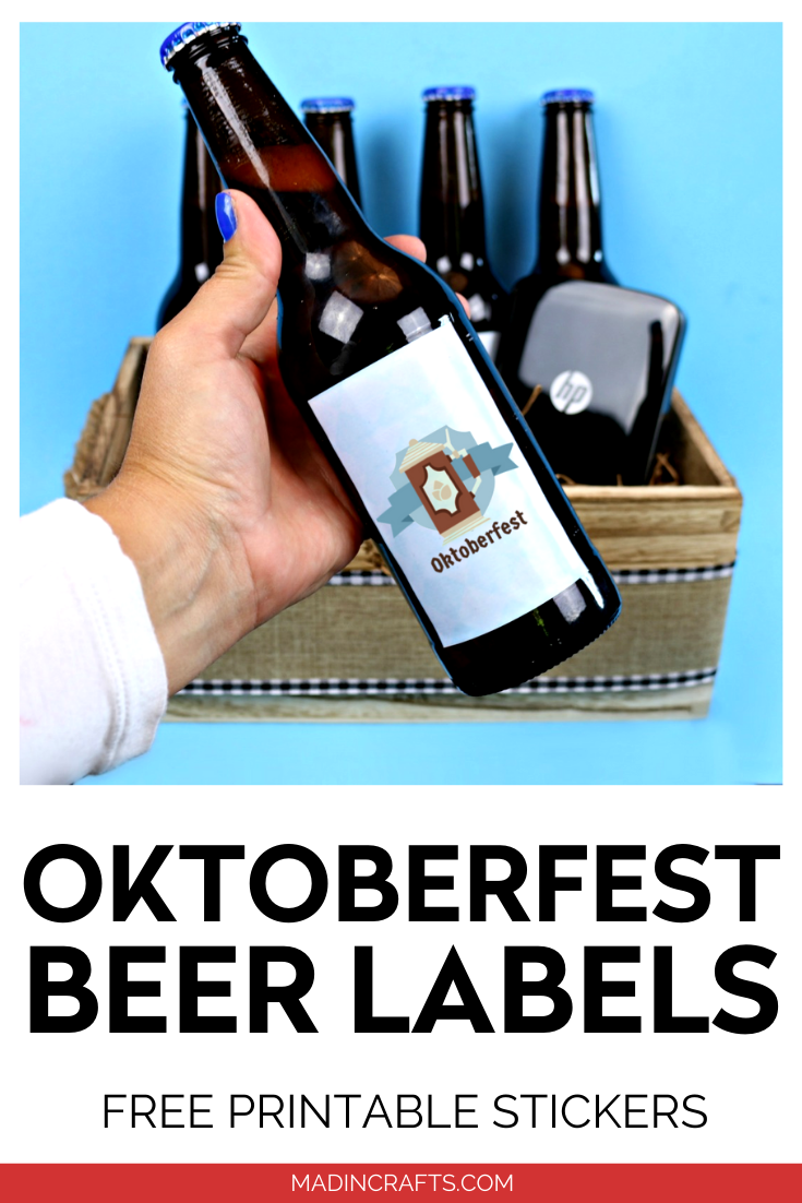 hand holding a Beer bottle with printable Oktoberfest sticker labels on a blue background