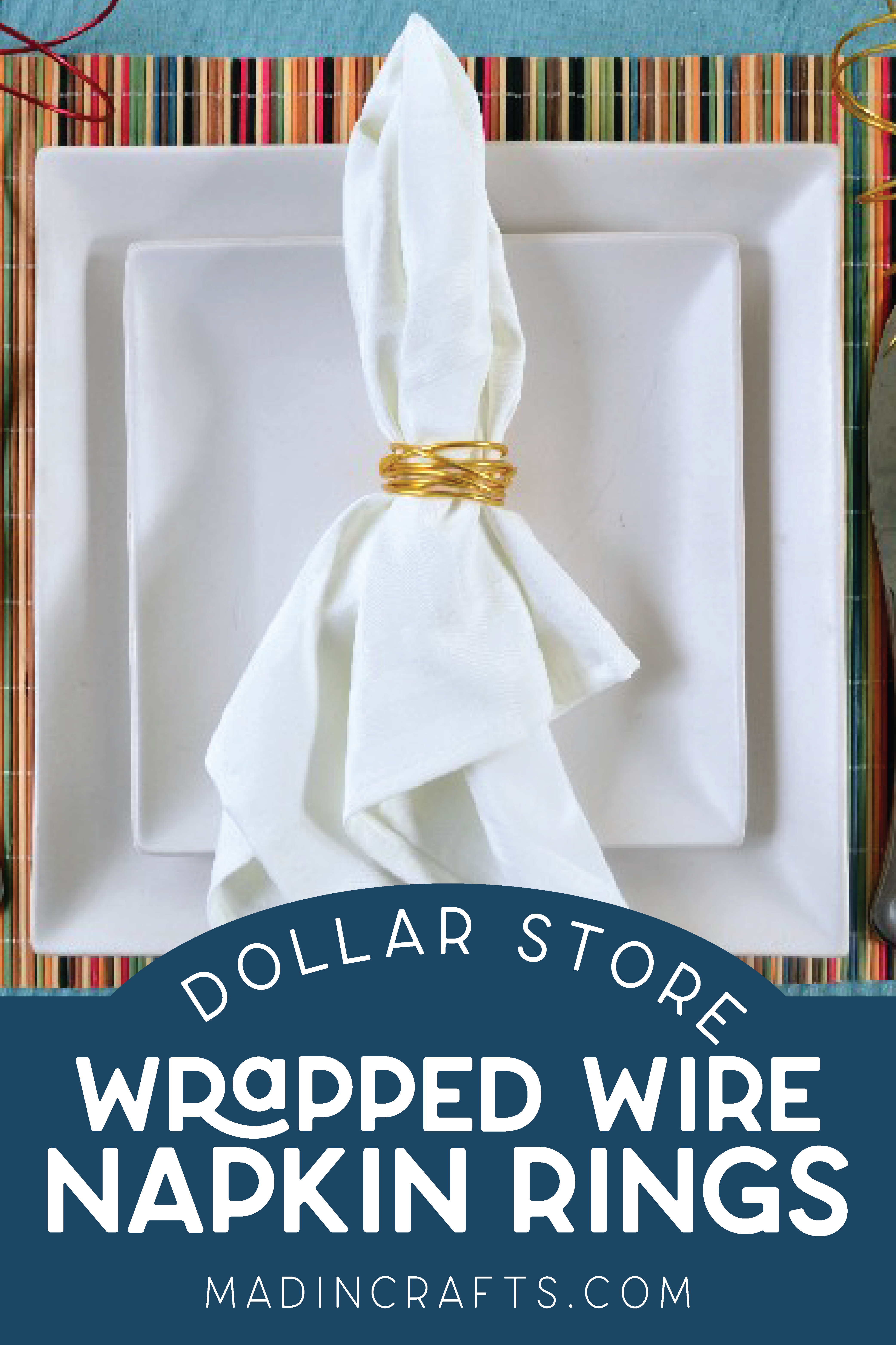 white napkin wrapped in gold wire napkin ring on a place setting