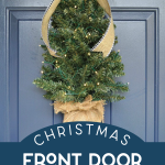 Mini Christmas tree on a blue front door