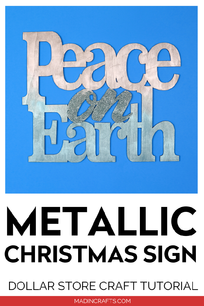 Silver and blue Peace on Earth sign on a blue background