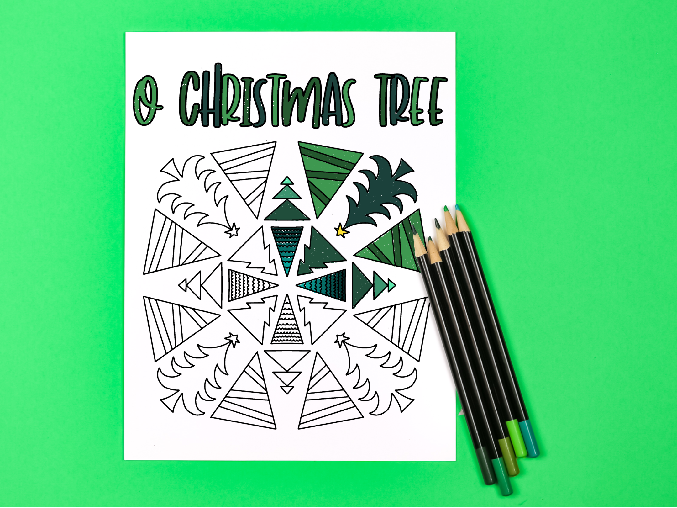 O Christmas Tree coloring page with colored pencils on a green background