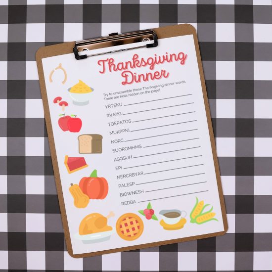 printable thanksgiving dinner word scramble on a clipboard on a buffalo check background