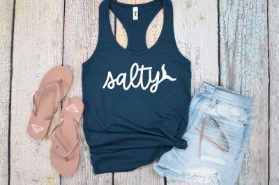 navy blue tank with Salty SVG next to flip flops and shorts