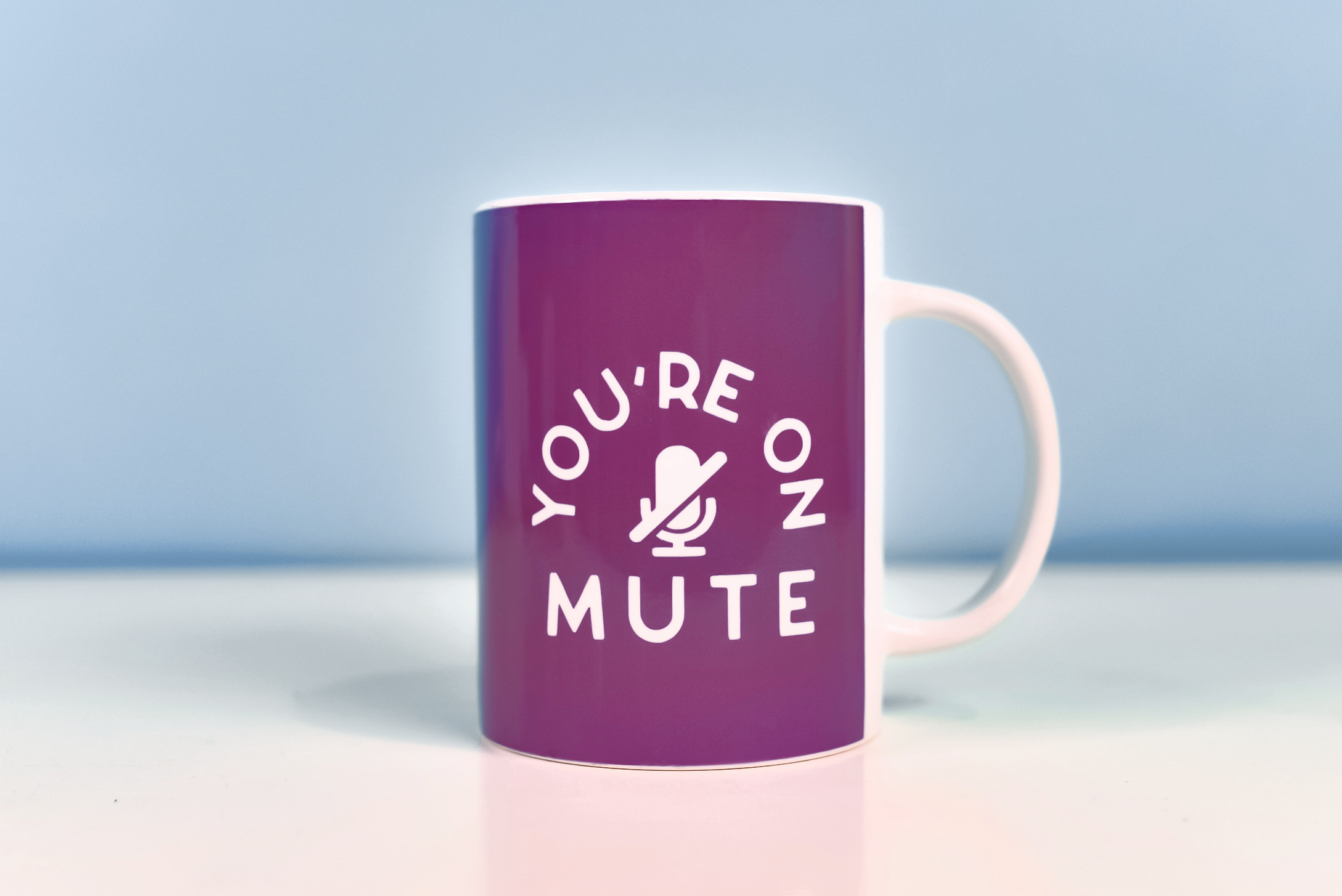 You're on Mute mug with a blue background
