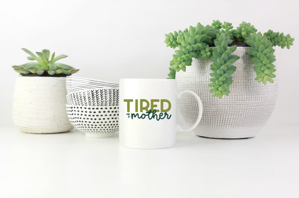 Tired as a Mother SVG file on a mug by houseplants