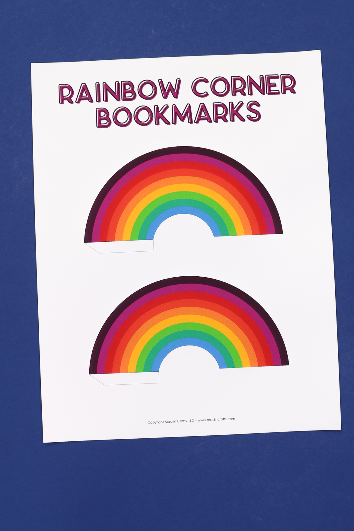 a printed paper with rainbow corner bookmarks