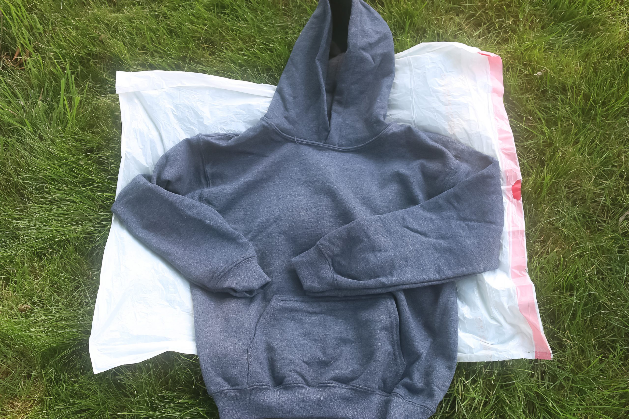 grey hoodie on a plastic sheet