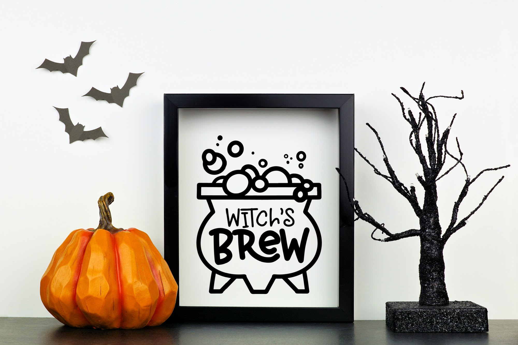framed witch's brew design in a halloween display