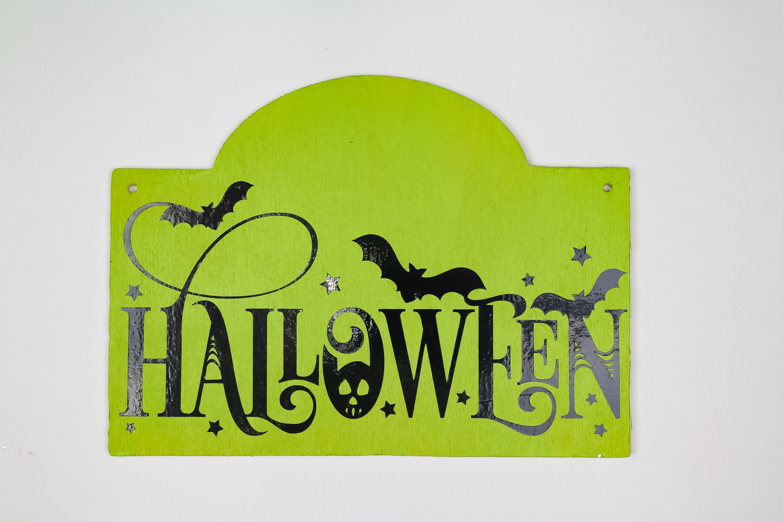 green sign with halloween design with black vinyl