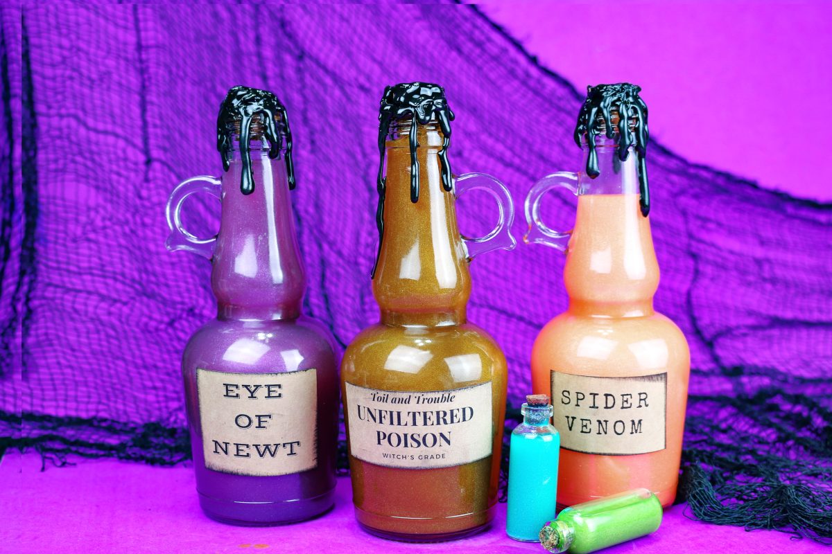 several DIY potion bottles on a purple background