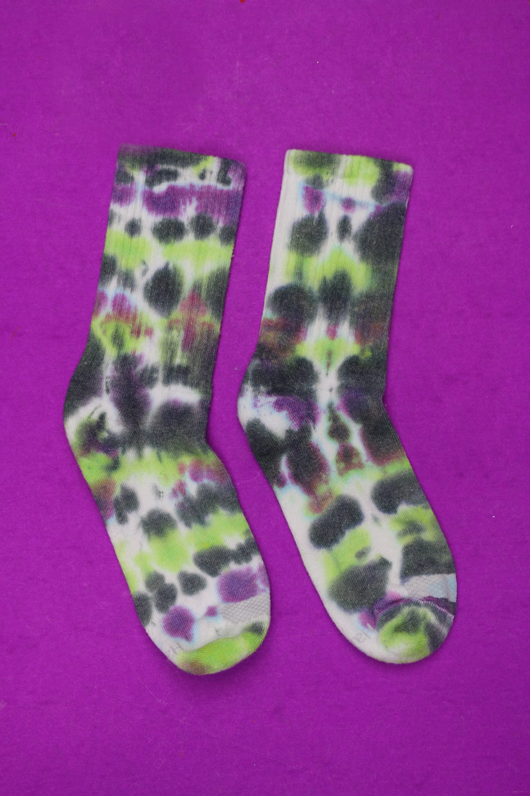 tie dyed socks on a purple background
