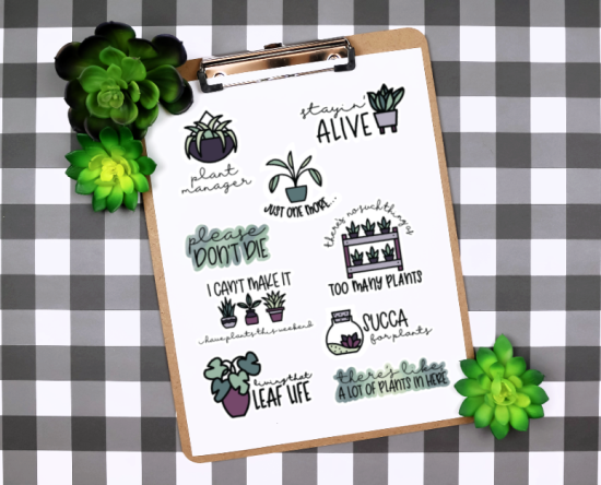 printable plant stickers on a clipboard near succulents
