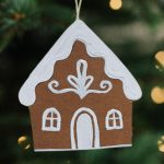 paper gingerbread house ornament on a Christmas tree