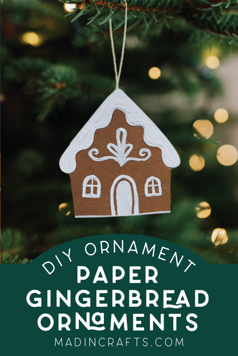 paper gingerbread house ornament on a tree