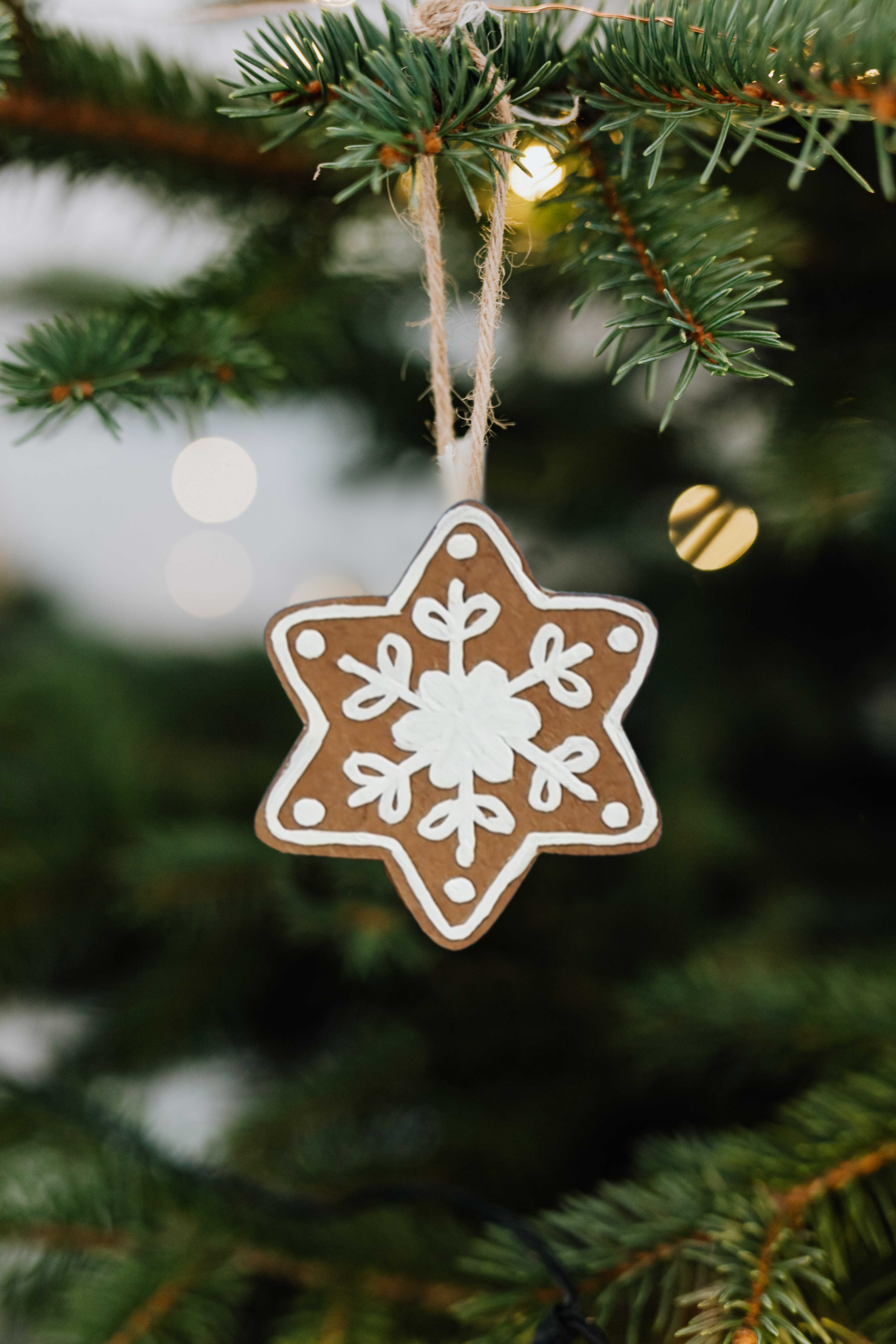 paper gingerbread cookie ornament on a christmas tree