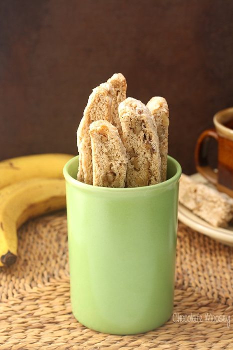 several banana walnut biscotti in a green mug