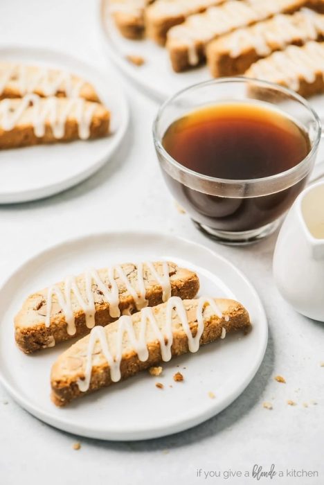drizzled almond biscotti near a cup of tea