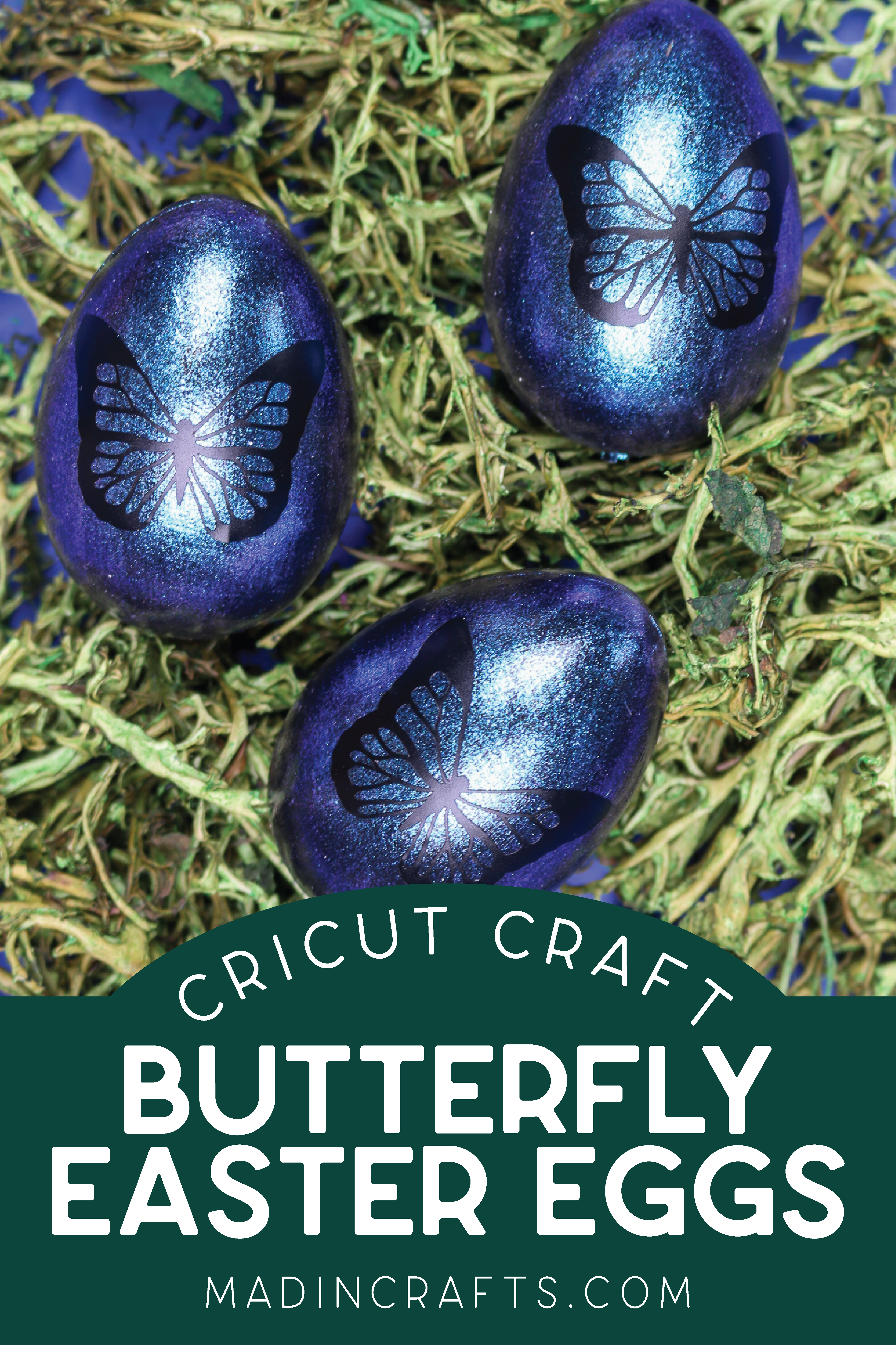 three blue butterfly easter eggs on reindeer moss