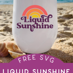 Liquid Sunshine design on a wine tumbler that is sitting on a beach