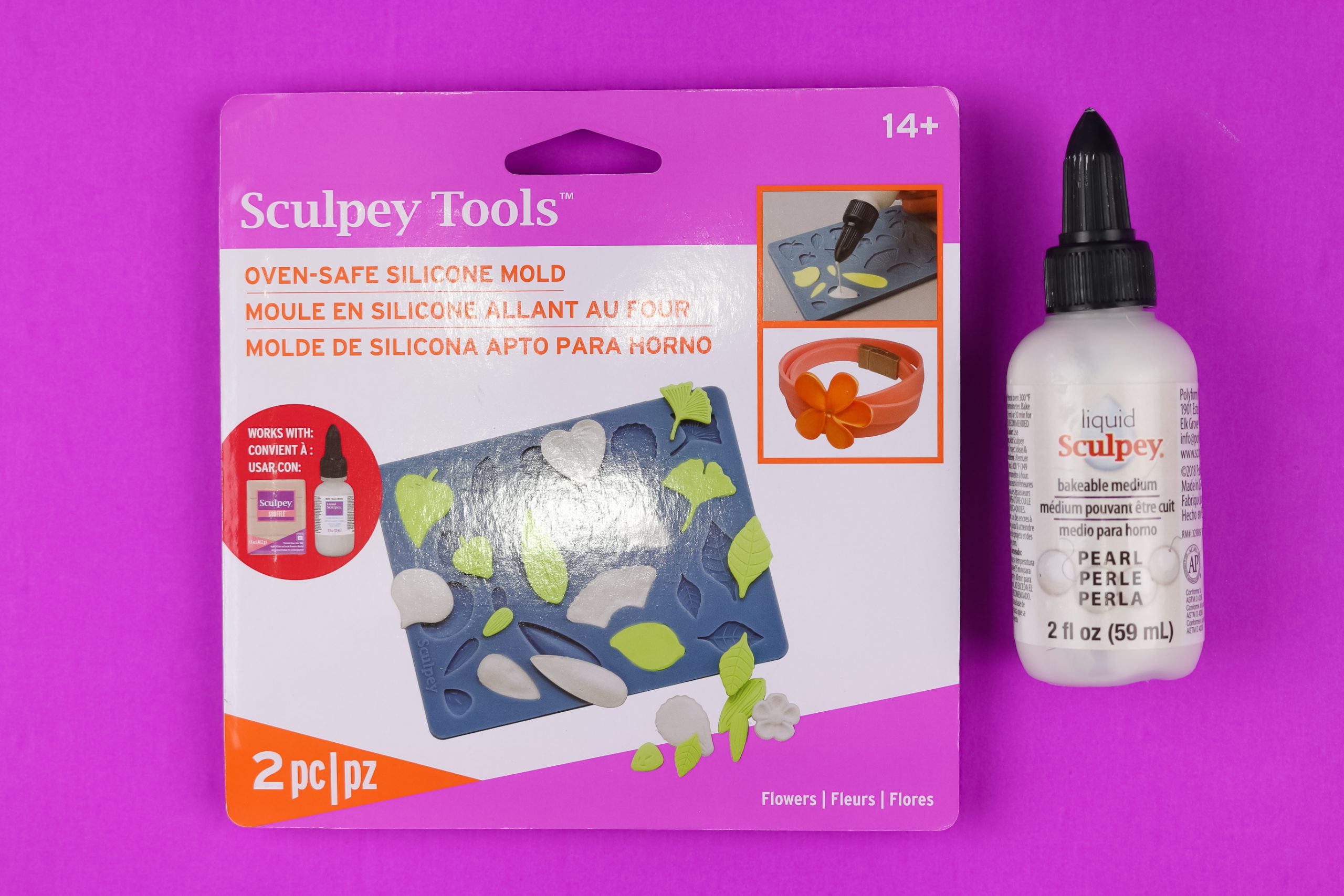 Sculpey flowers mold in its packaging next to a bottle of Pearl Liquid Sculpey