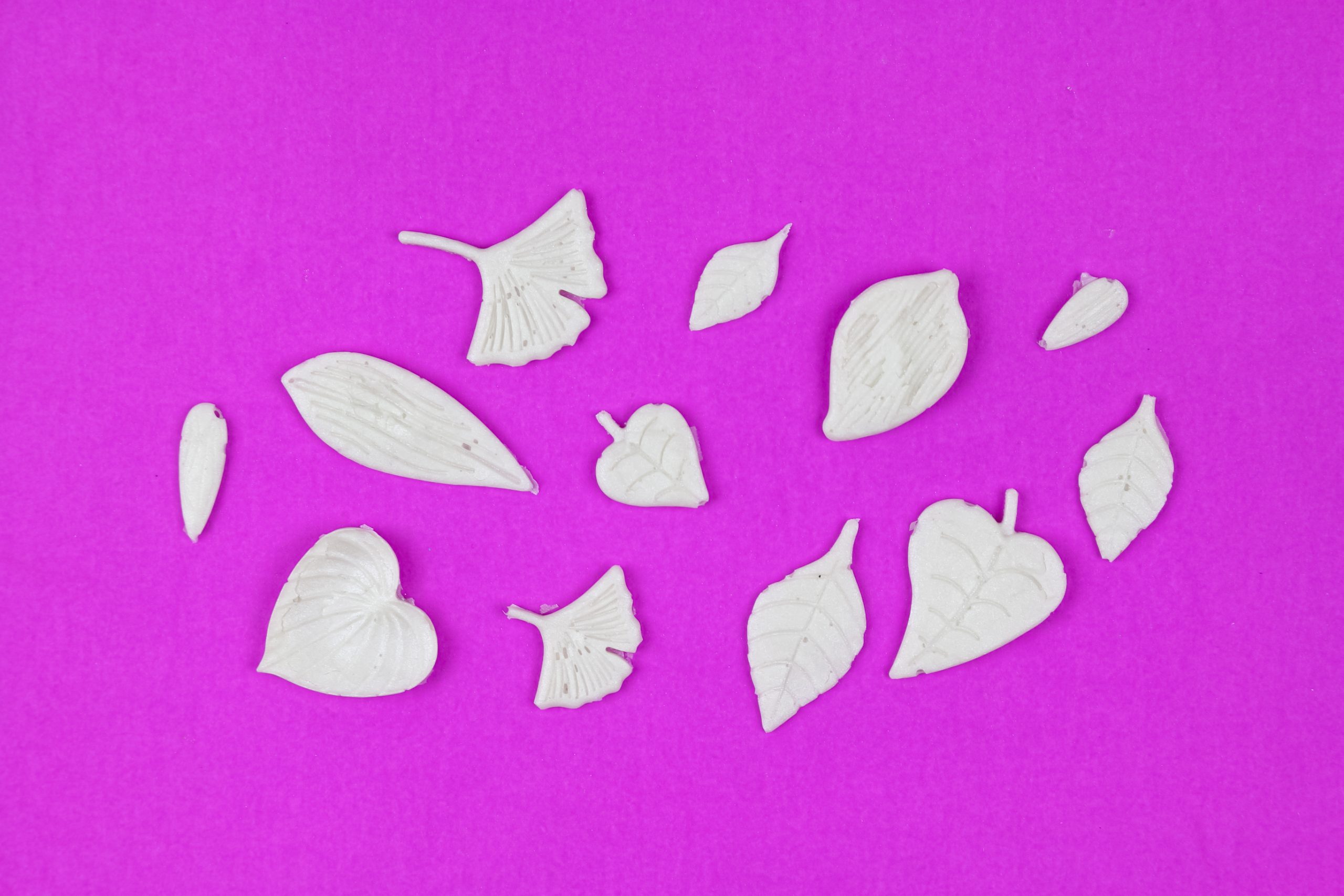 white leaf shapes removed from the Sculpey flower mold