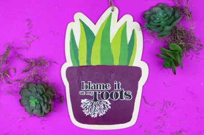 Painted Plant sign that reads: Blame it on my roots
