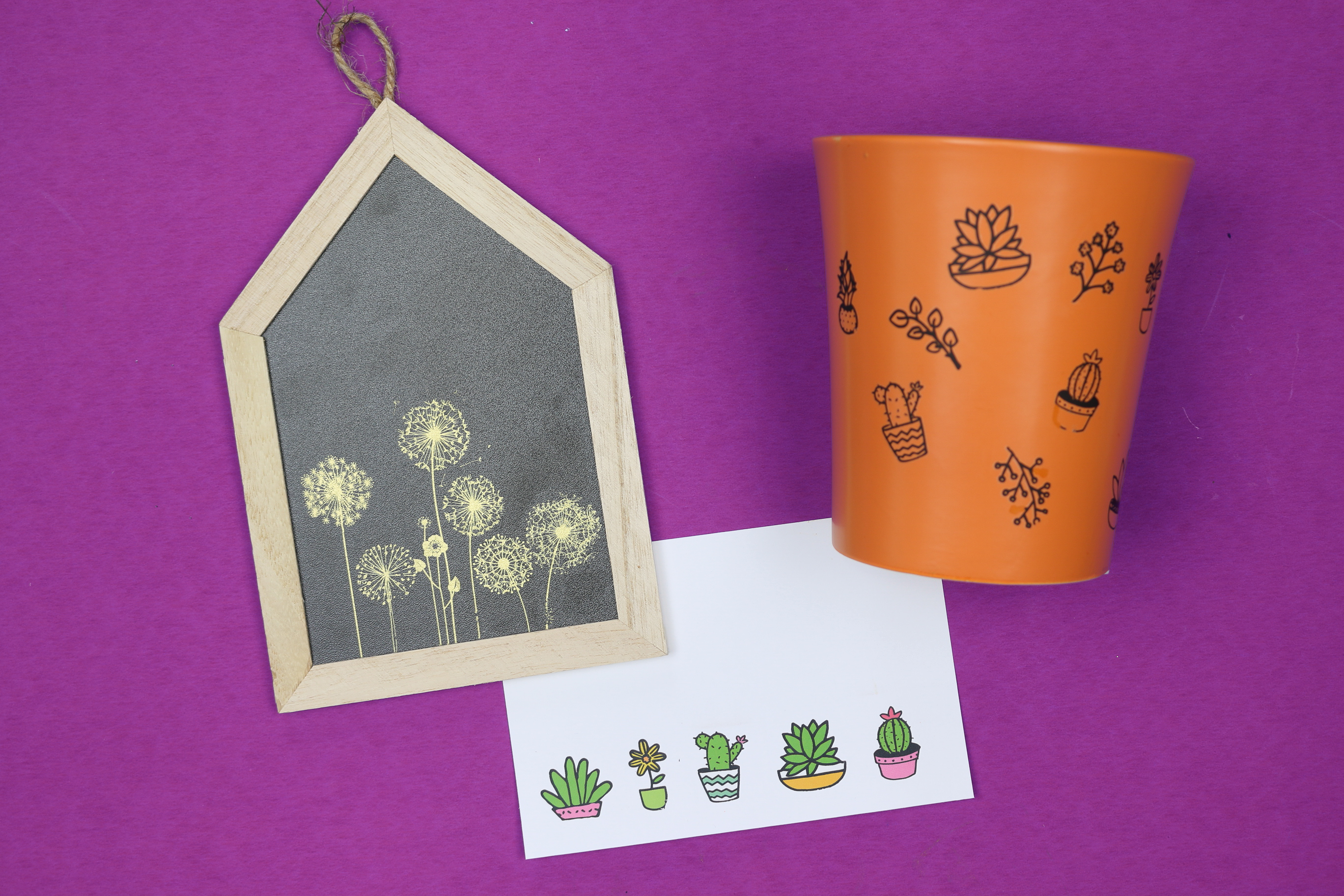 Sign, cards, and pot decorated with dollar store rub on transfers