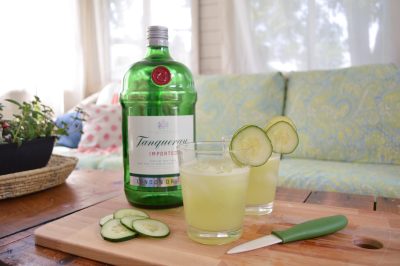 cucumber lime gin and tonic cocktails on a sunroom table