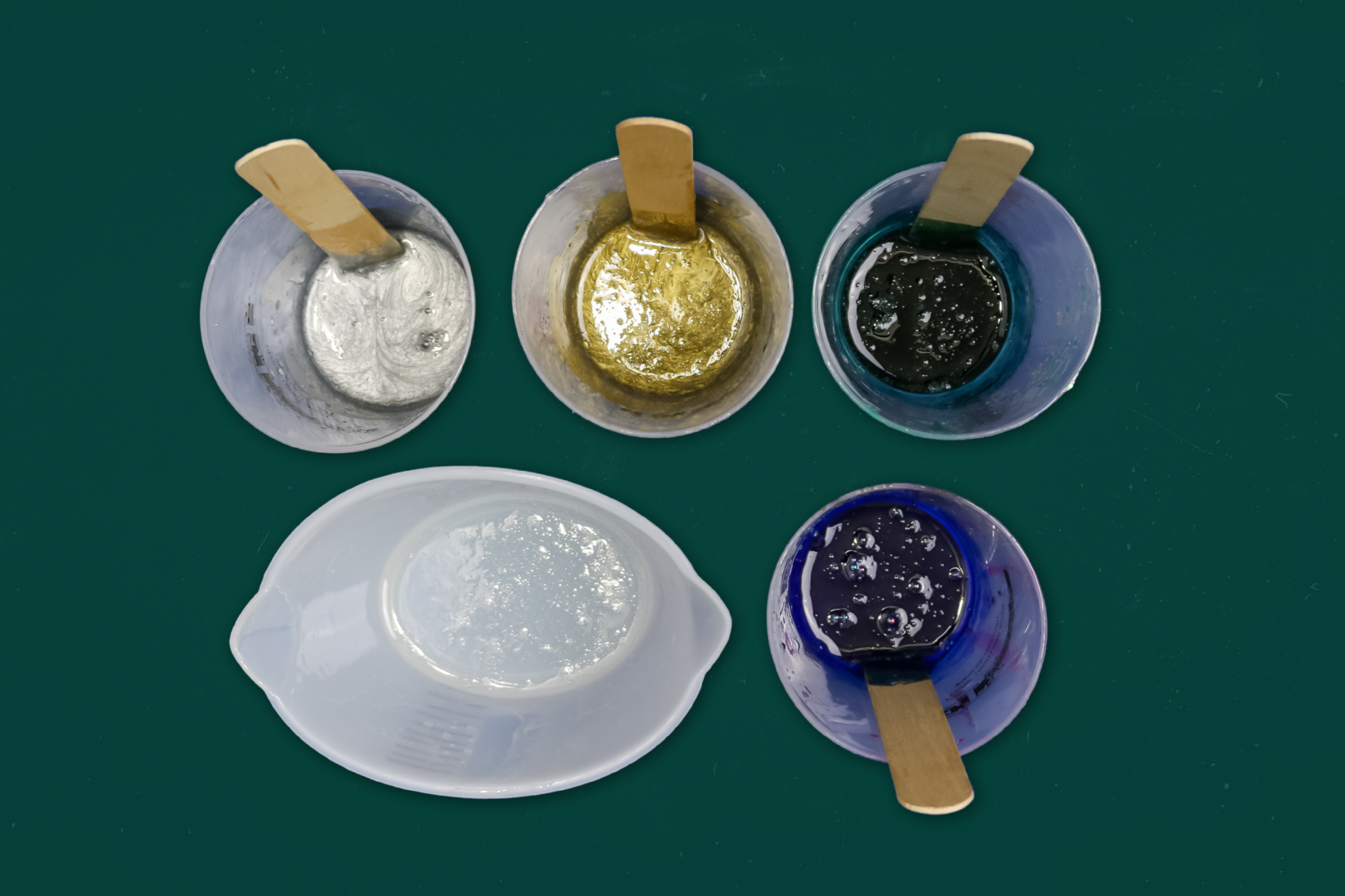 colored resin in mixing cups